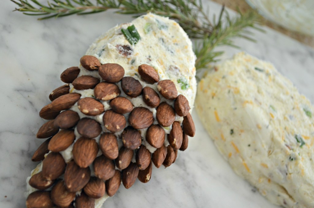 adding almonds to a cheeseball