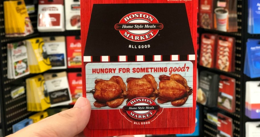 holding a Boston Market gift card
