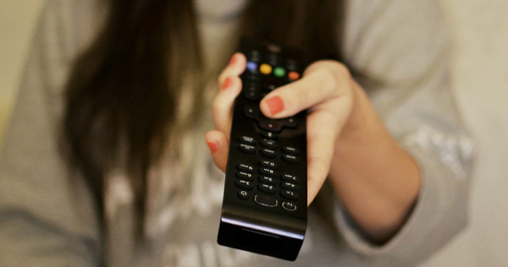 woman holding remote