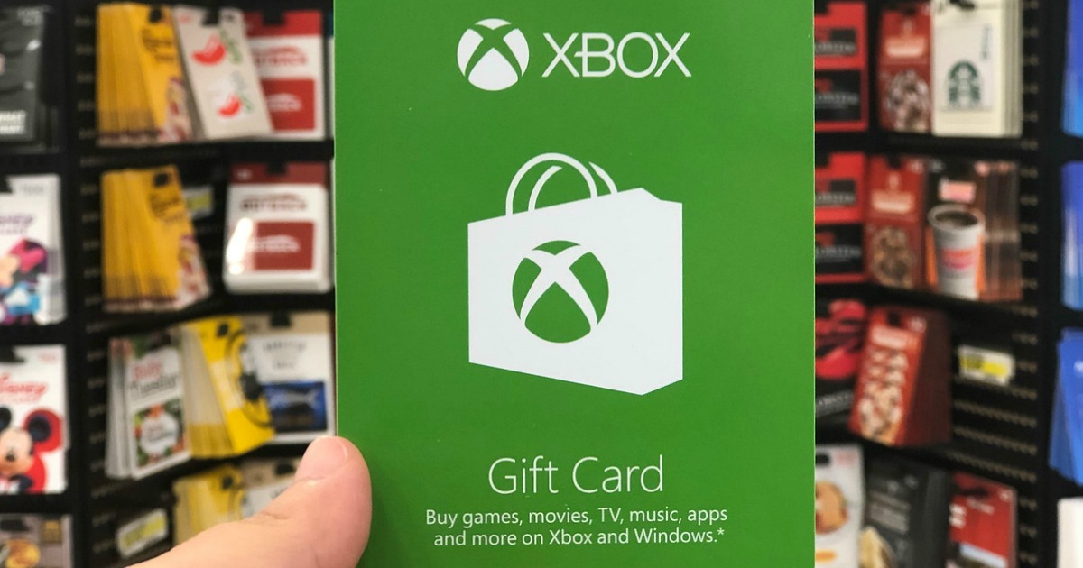 holding green xbox gift card