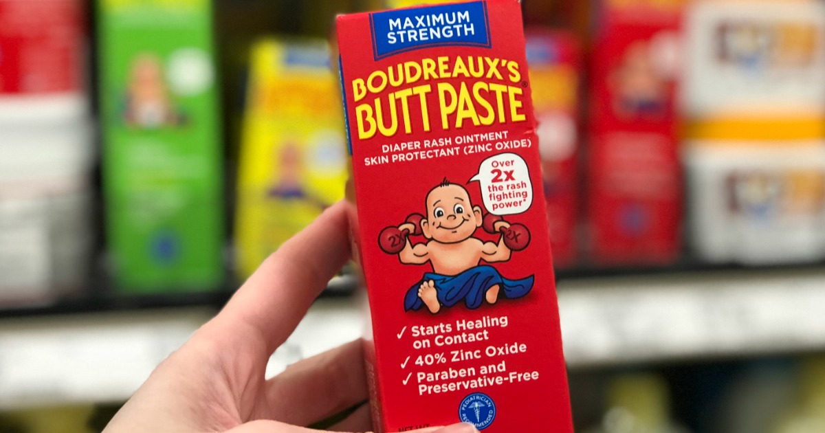 hand holding Boudreaux's Butt Paste in hand at store