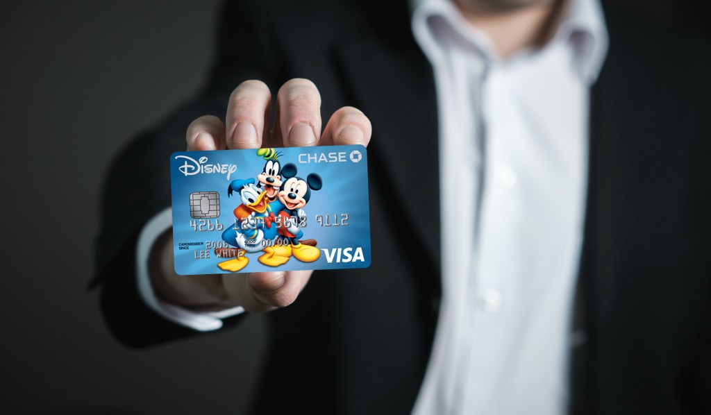 man holding Disney credit card 