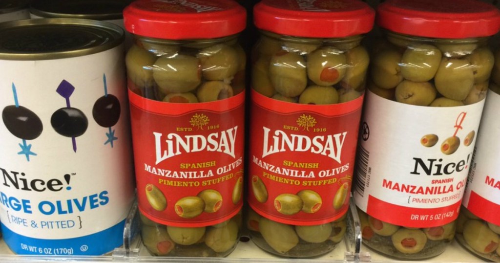 4 jars of olives on shelf 
