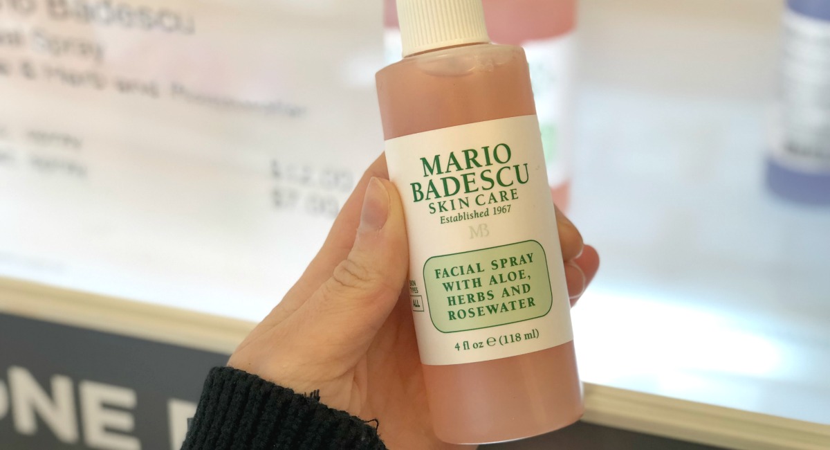 hand holding a bottle of mario badescu skin care best make up brands cheap vs luxury