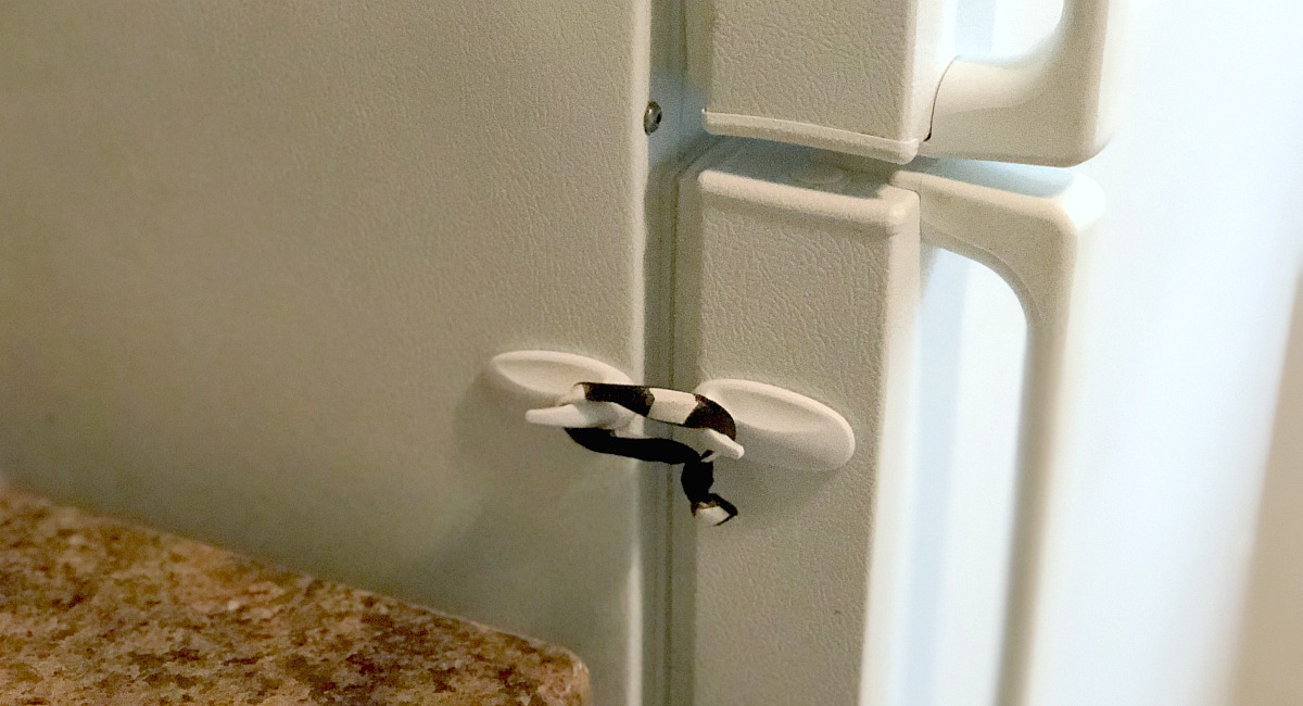 baby-proof your fridge with command hooks and hair ties