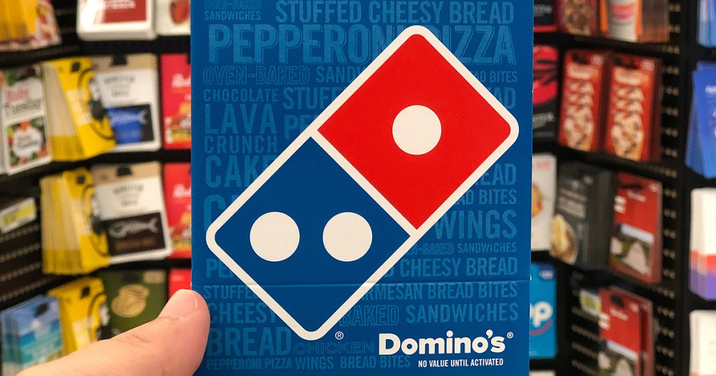 hand holding a Domino's gift card