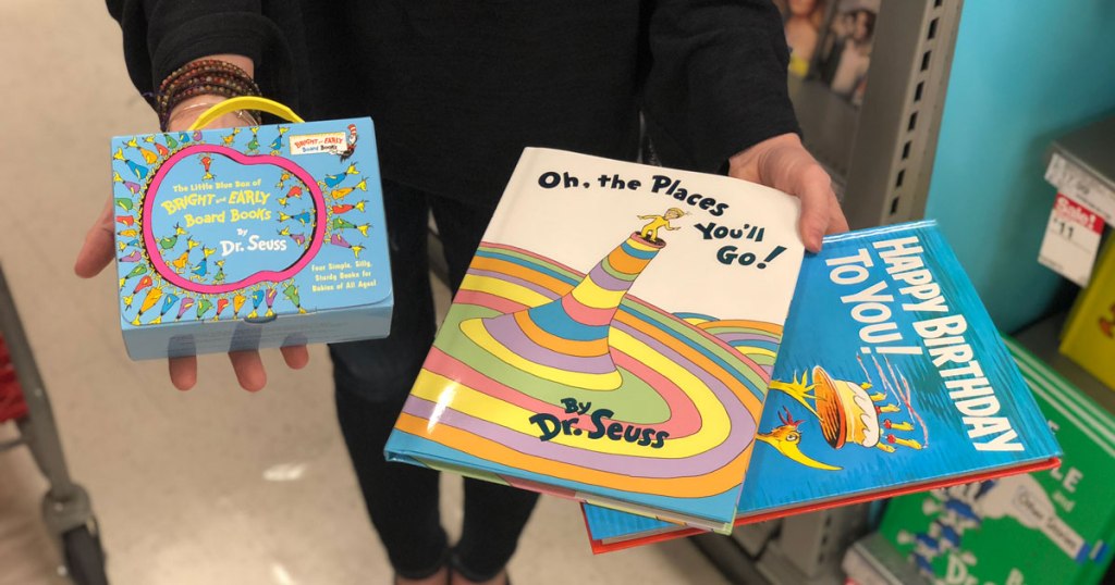 hand holding Dr Seuss books