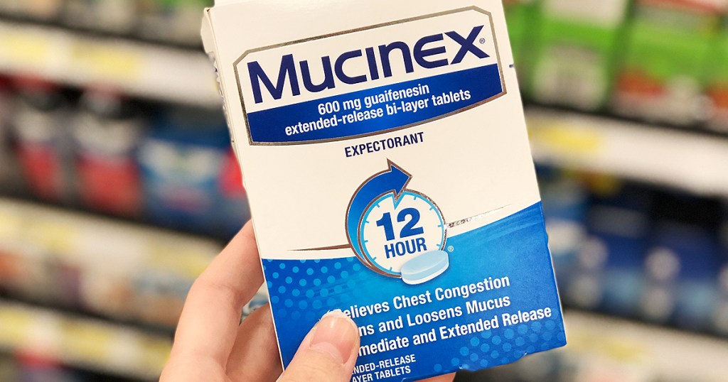 hand holding mucinex box Rite Aid