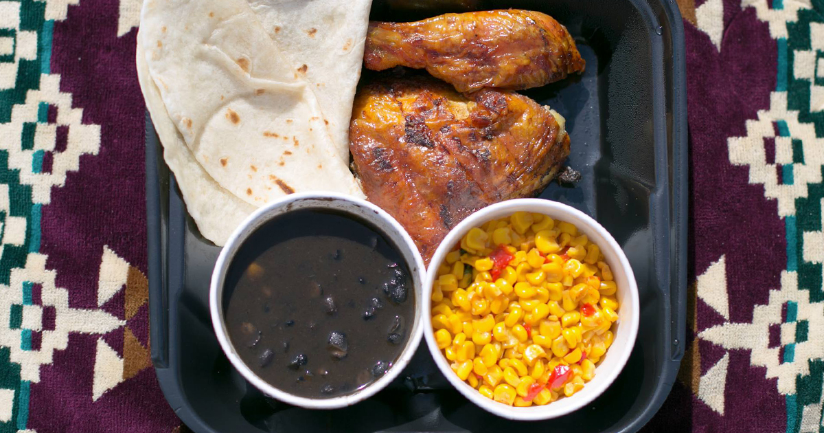 chicken tortillas, and side dishes on a tray