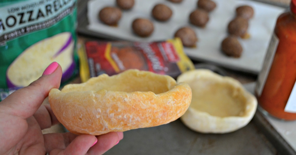 holding an empty bread bowl