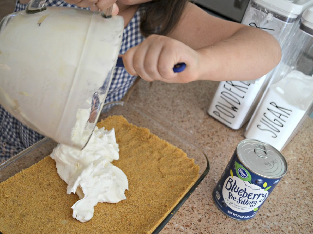 Spread the cheese mixture over the baked, cooled crust.