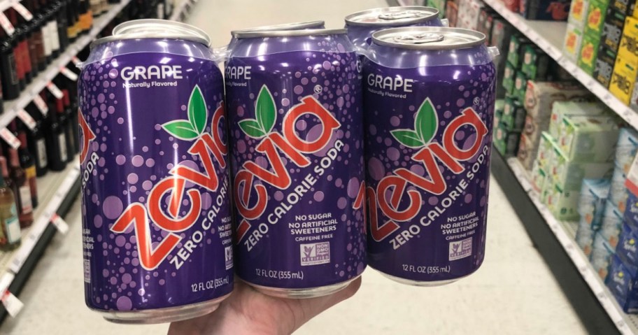 Hand holding Zevia Grape Soda at Target