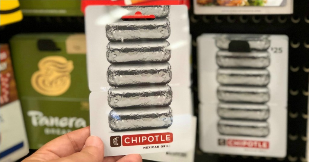 someone holding a Chipotle gift card at a store