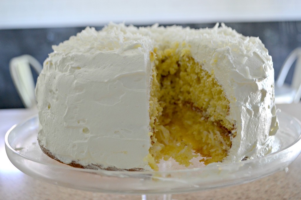 coconut cake with slice missing 