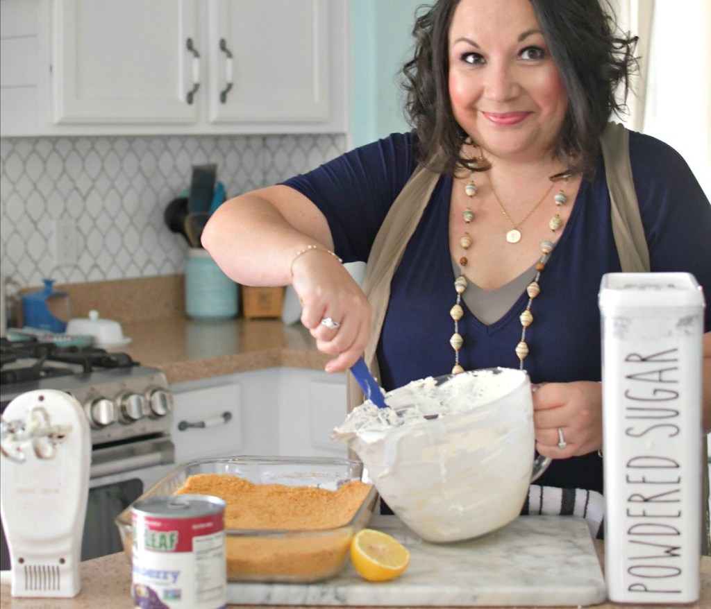 woman mixing blueberry cheesecake dessert 