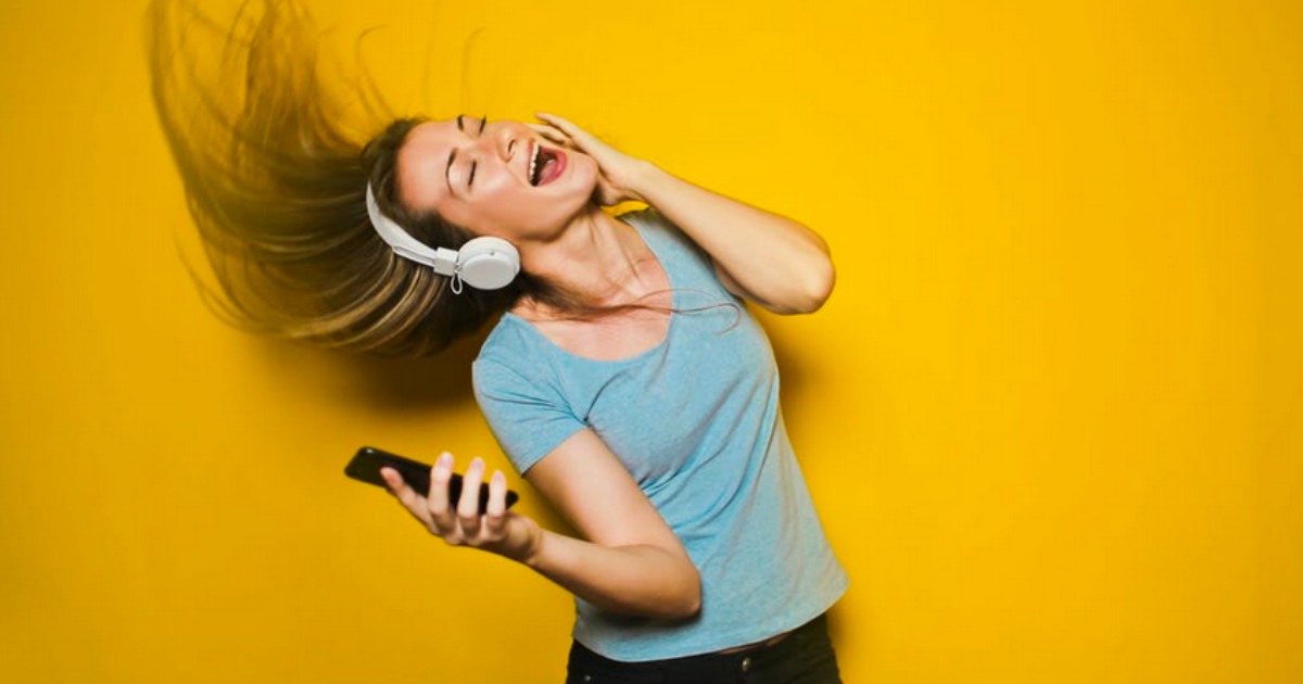 woman with headphones listening to music
