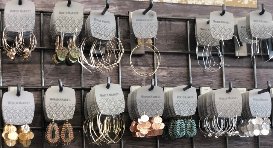 world market earrings hanging in store