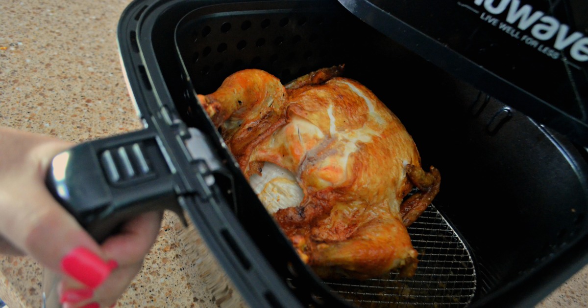 cook a whole chicken in the air fryer in about an hour - chicken in the air fryer ready to be cooked