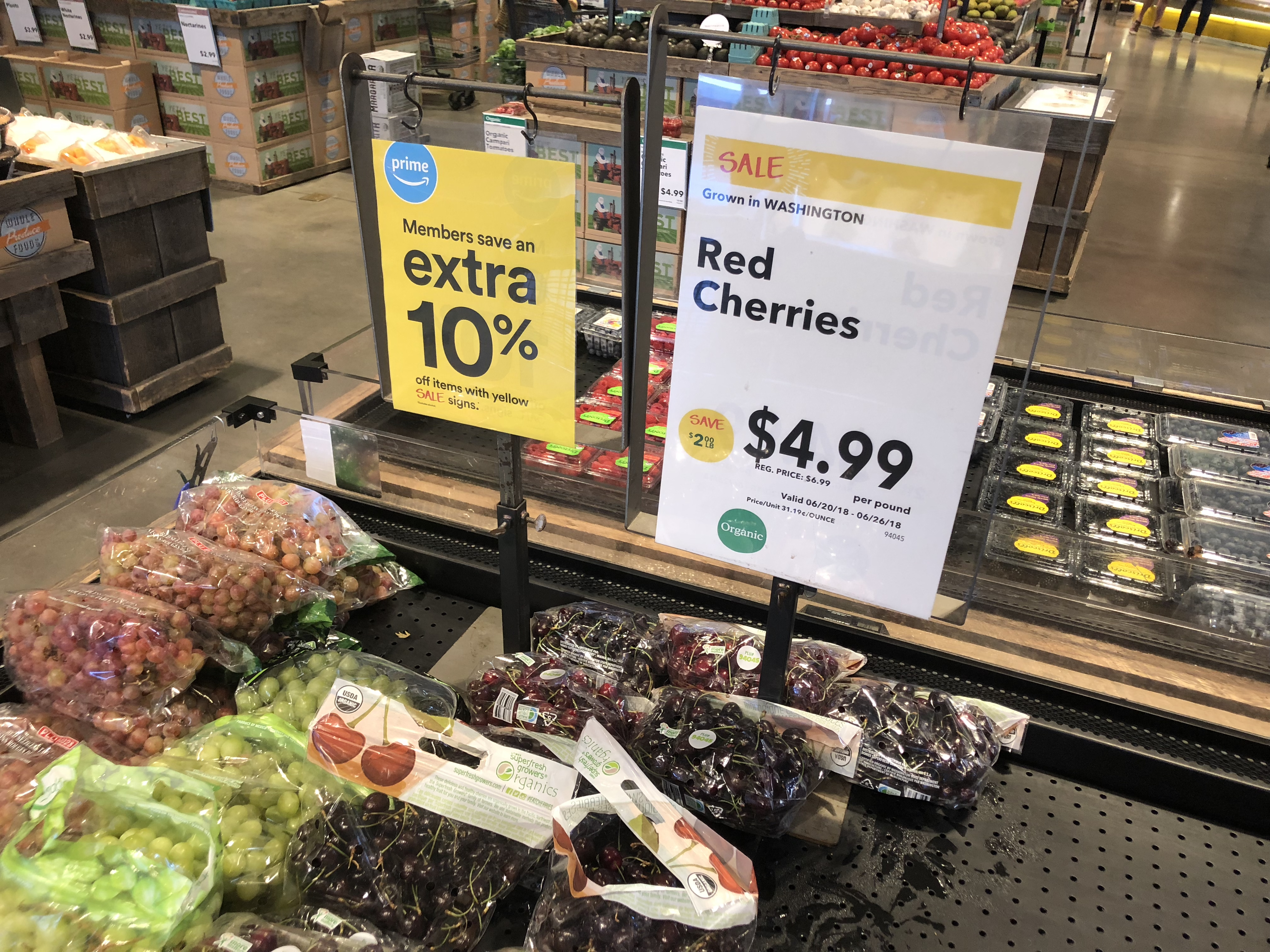 money-saving hacks at Whole Foods Market – yellow labels in produce promise 10% extra savings