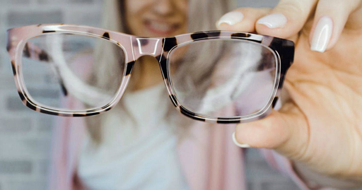 GlassesShop.com glasses being held by a woman