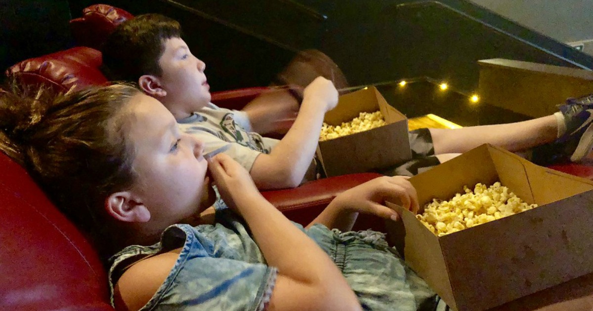 kids in movie theater eating popcorn