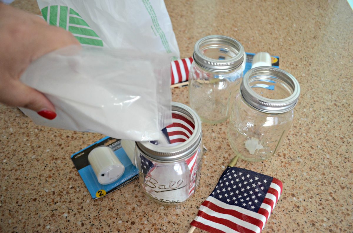 Dollar Tree 4th of July Craft Mason Jar Votives – filling jars with sand