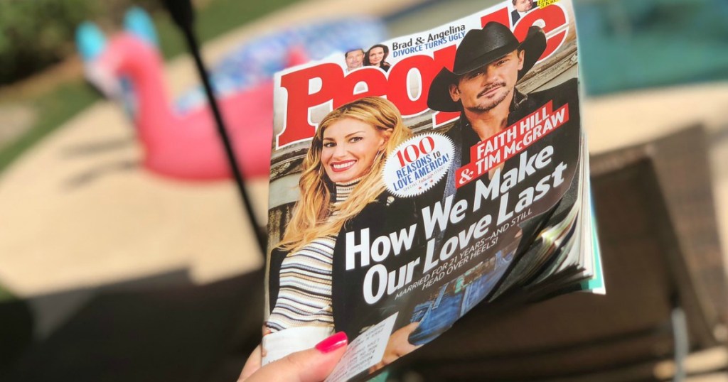 holding People magazine by the pool 