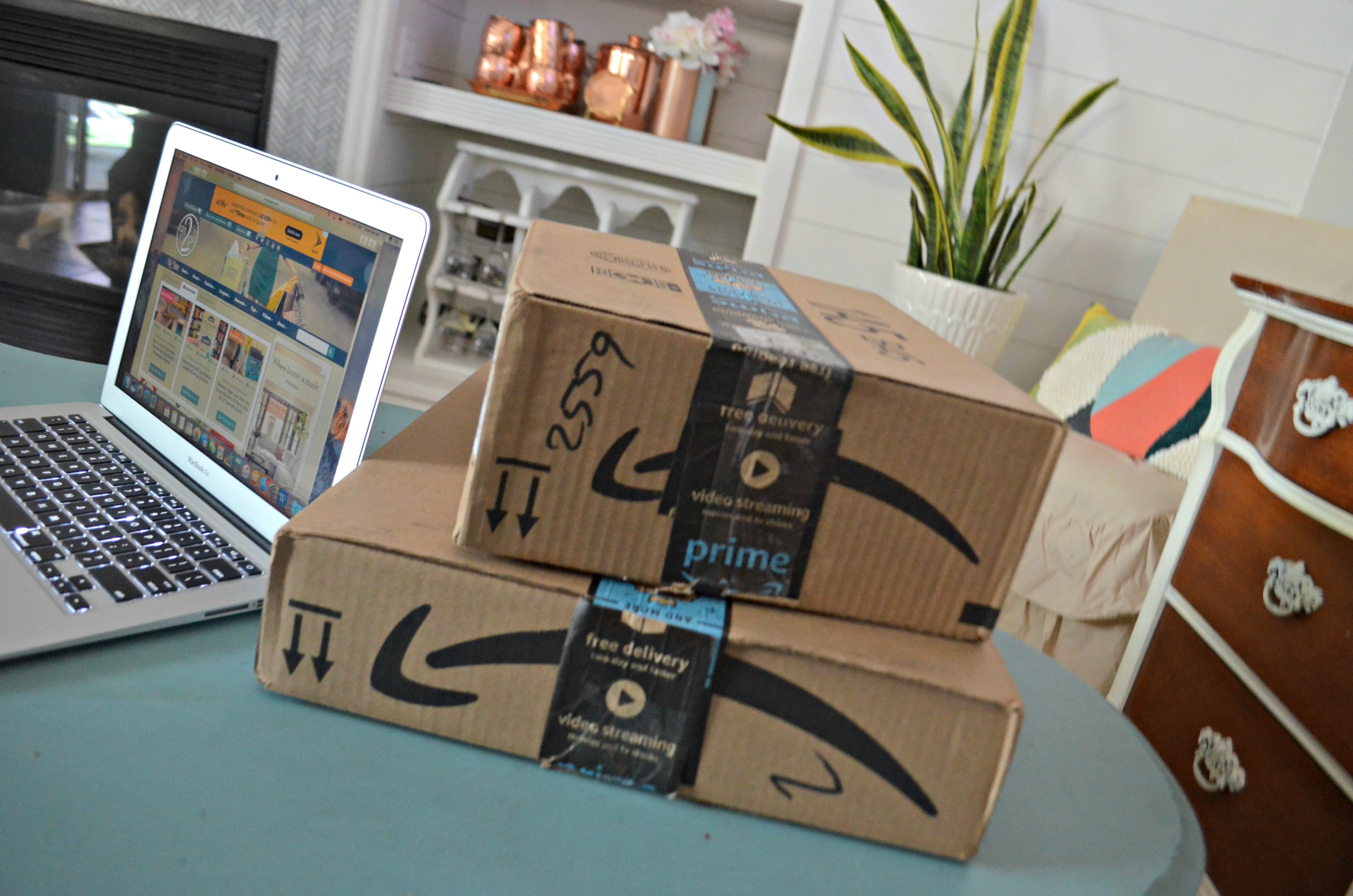 amazon prime day deals | Amazon boxes stacked on a table