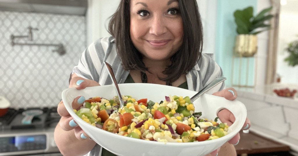 woman holding corn salad