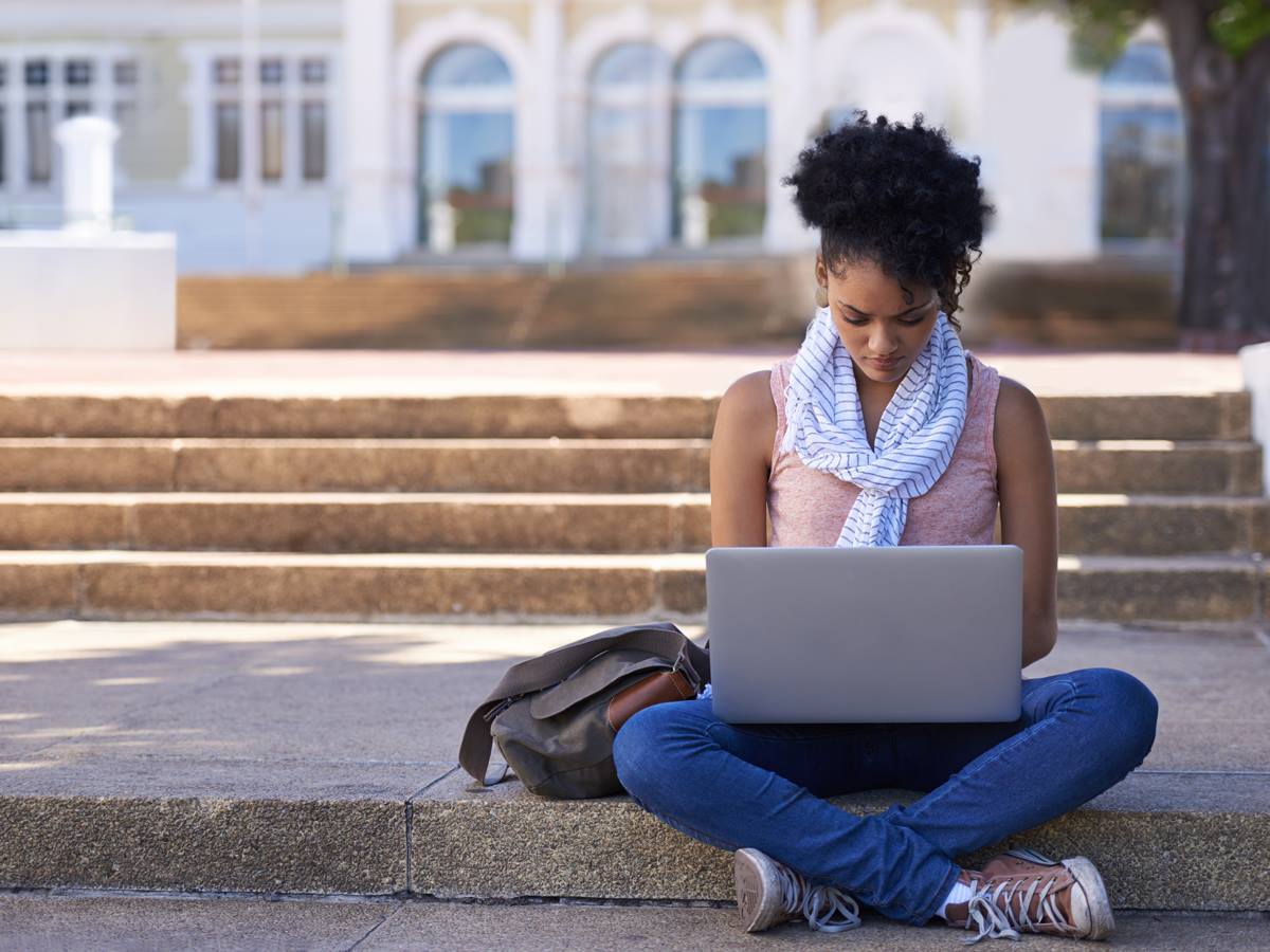 College students can enjoy a 6-month Amazon Prime membership free. - student with laptop