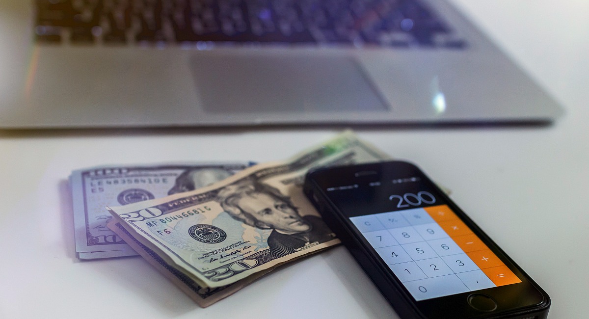 moving hacks to save money include asking your company to cover the move – cash and calculator