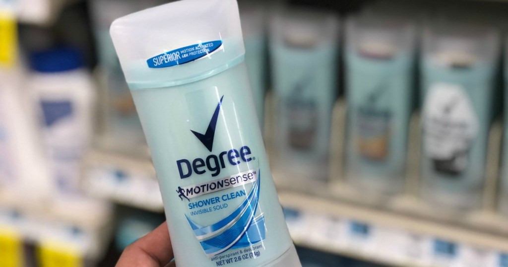 hand holding deodorant in store