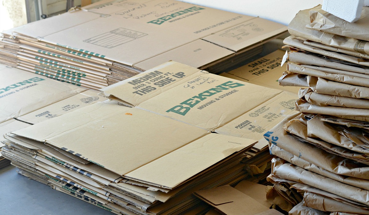 moving hacks to save money include — flattened moving boxes you can get for free