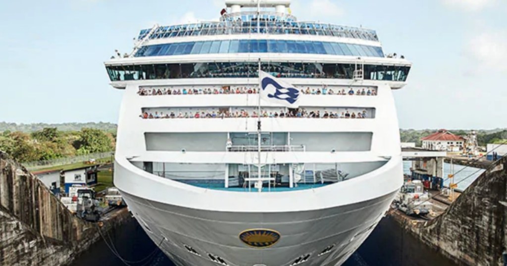 front huge ship with people on deck