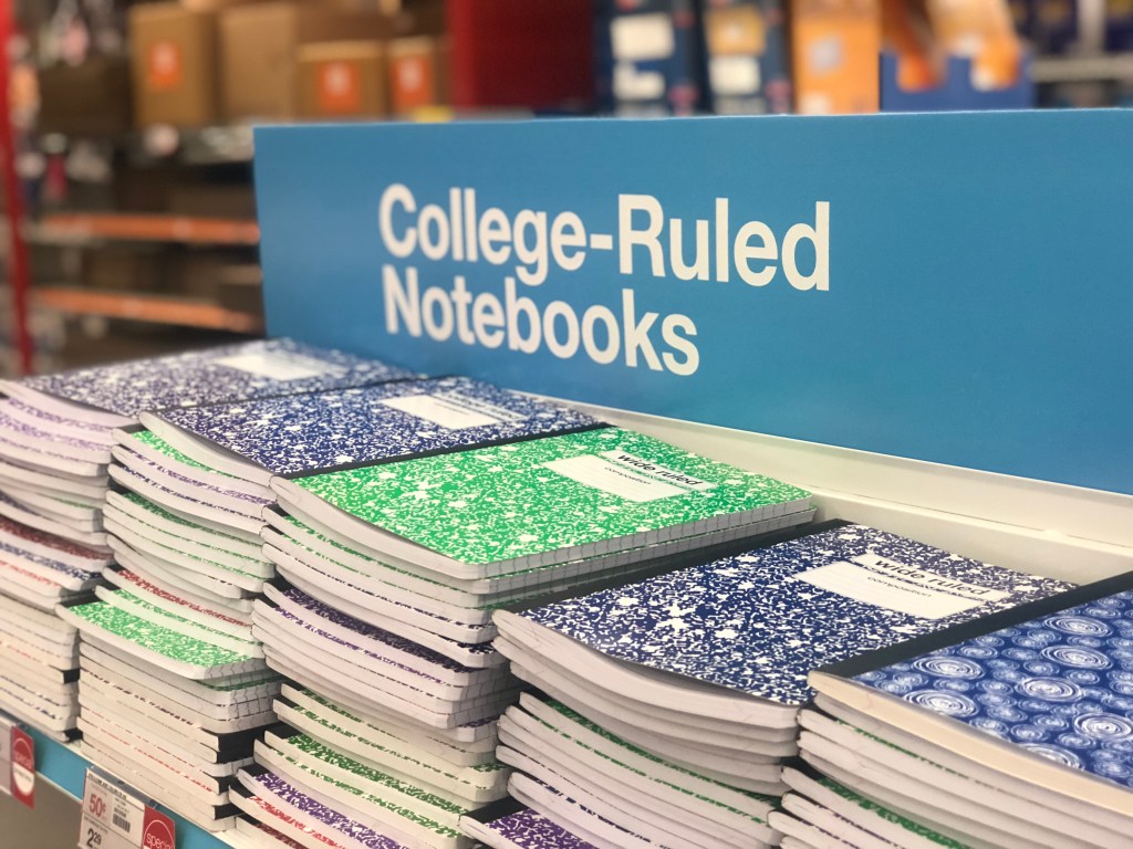 stacks of composition books displayed in store