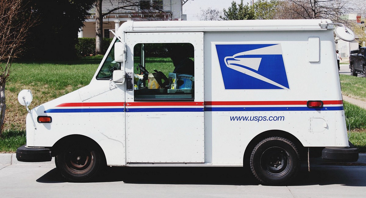 moving hacks to save money include signing up for an address change — usps mail truck