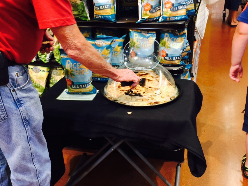 money-saving hacks at Whole Foods Market – rice chips samples on a table
