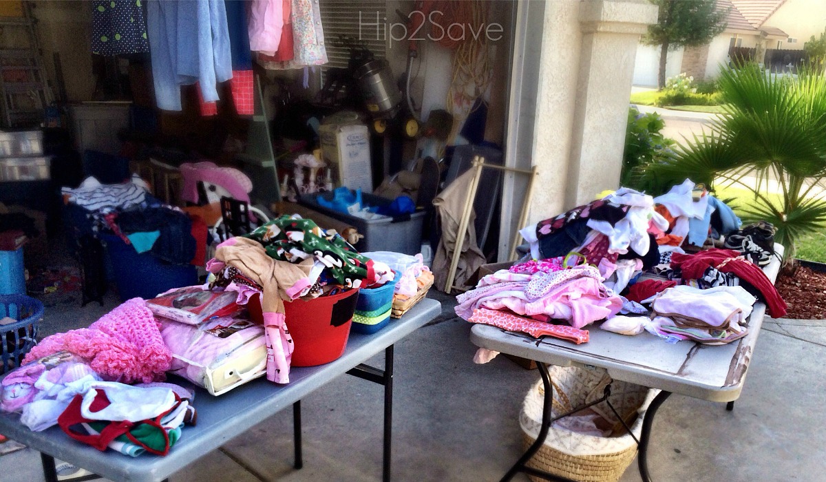 moving hacks to save money include having a yard sale with tables of clothes