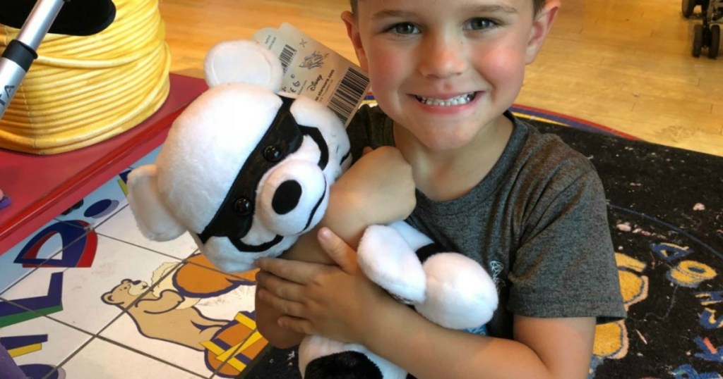 boy holding build a bear