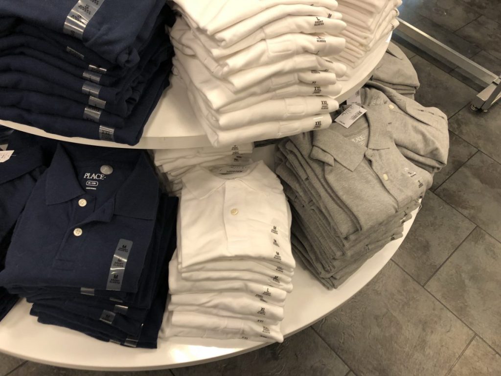 Children's Place Uniform Polos on round display table
