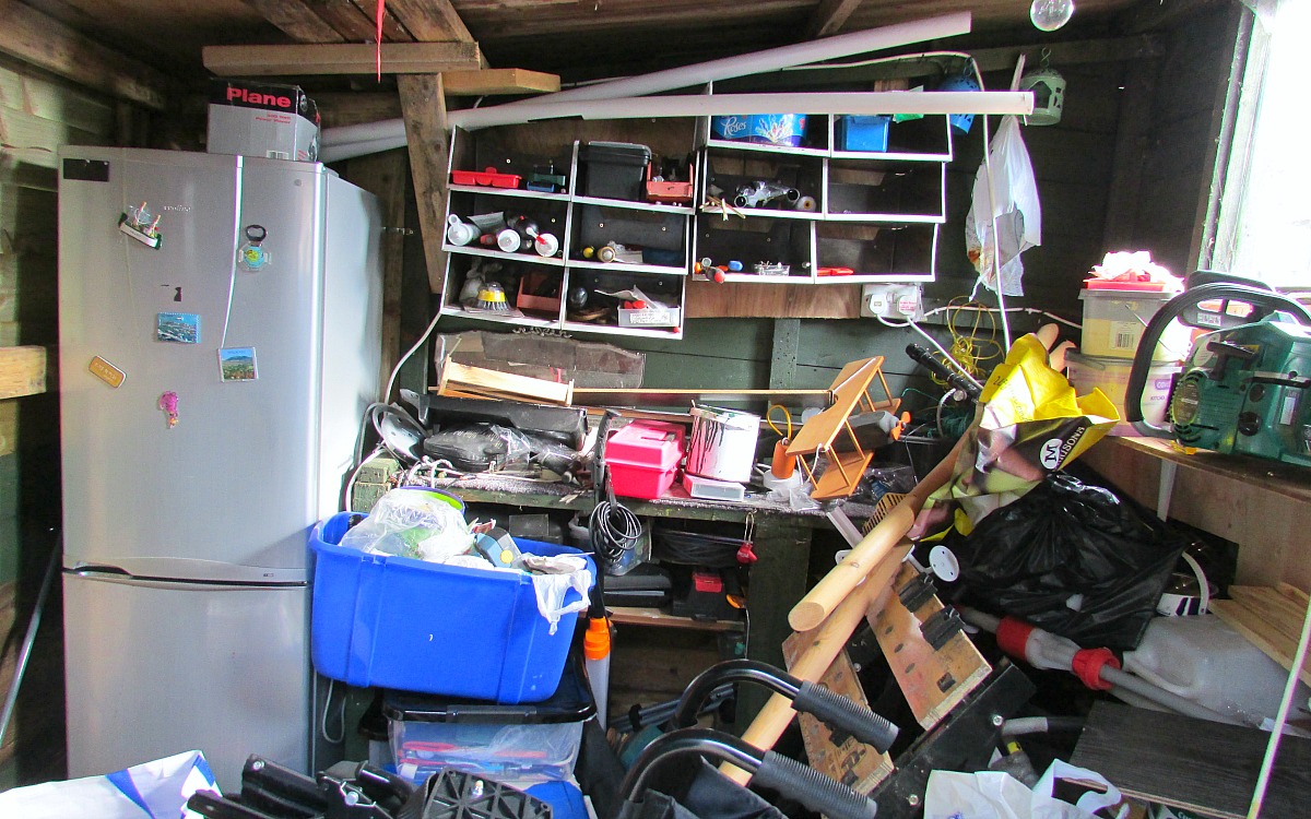 simple tricks & tips for decluttering your home — garage filled with clutter and unorganized