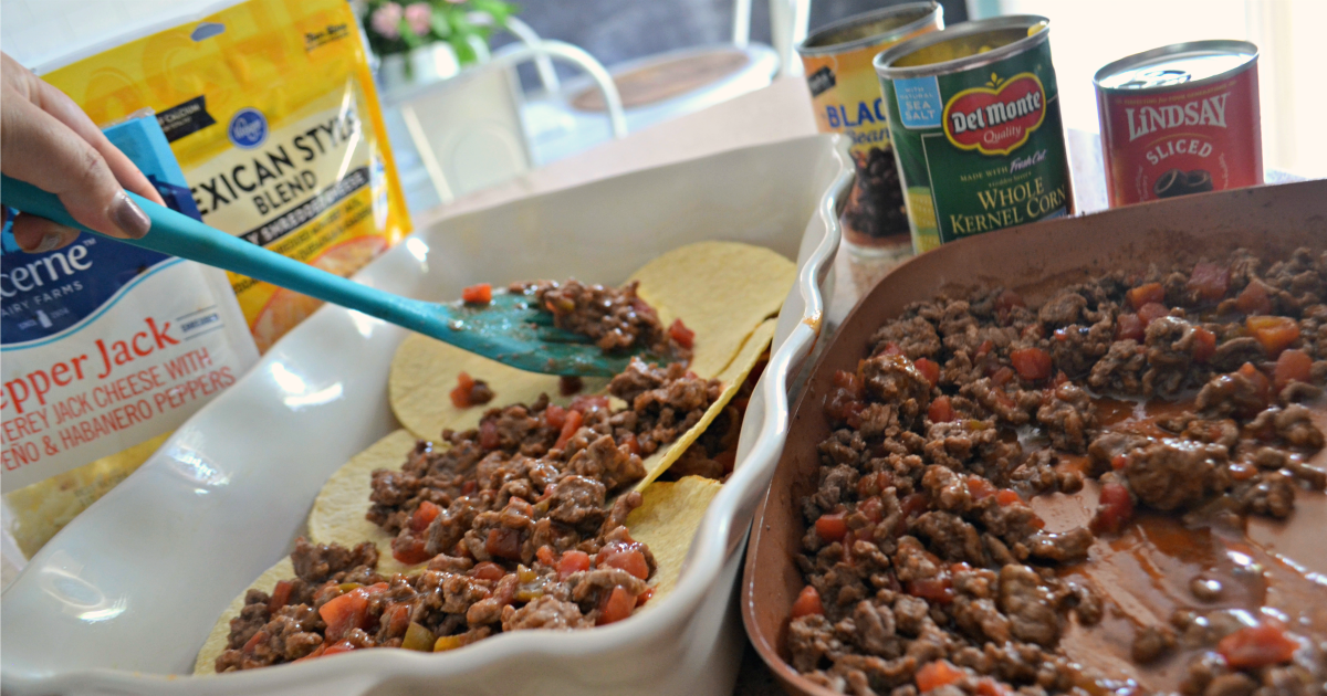Easy Mexican Lasagna - Spooning meat onto the shells