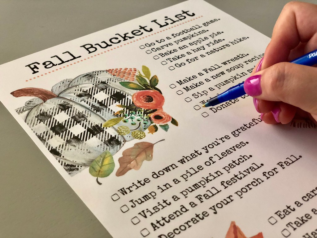 Filling out our free printable fall bucket list 
