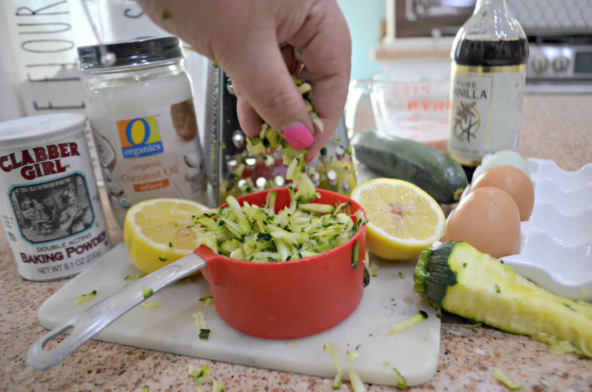 shredded zucchini in a measuring cup 