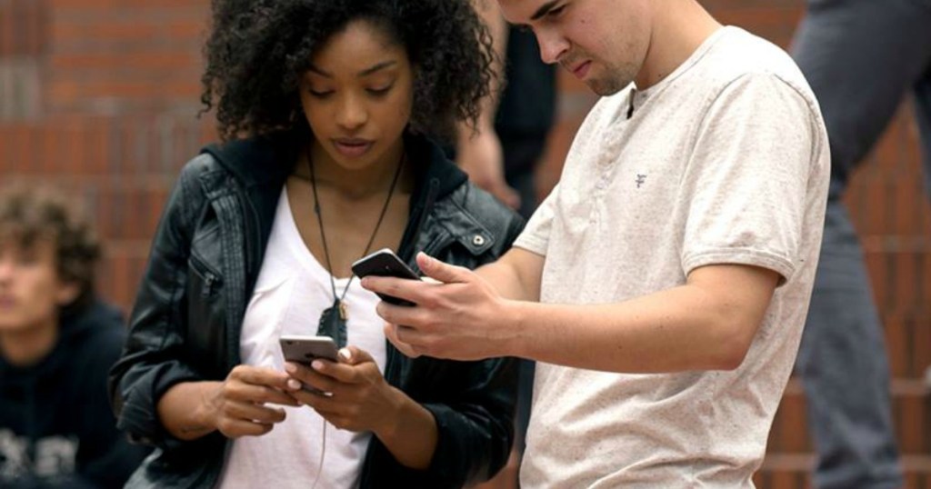 Couple holding T-Mobile phones