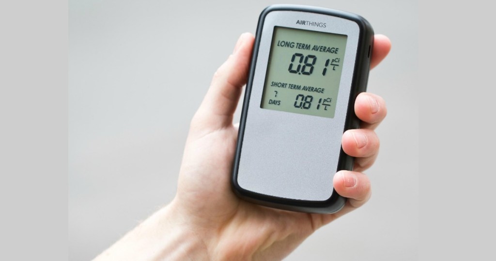 airthings radan detector in womans hand