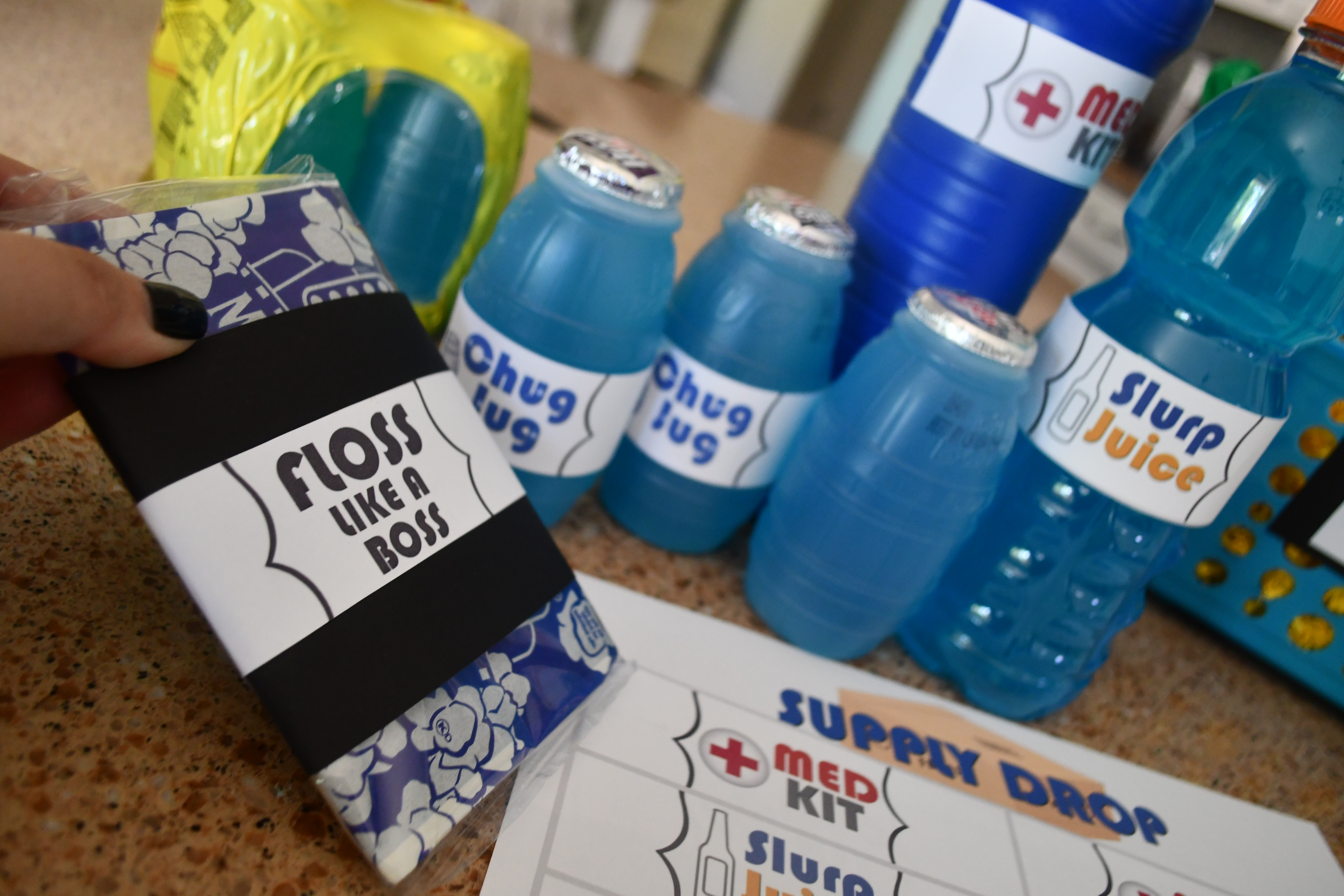 DIY Dollar Tree Fortnite Gift Basket items to place in the basket, including drinks and popcorn