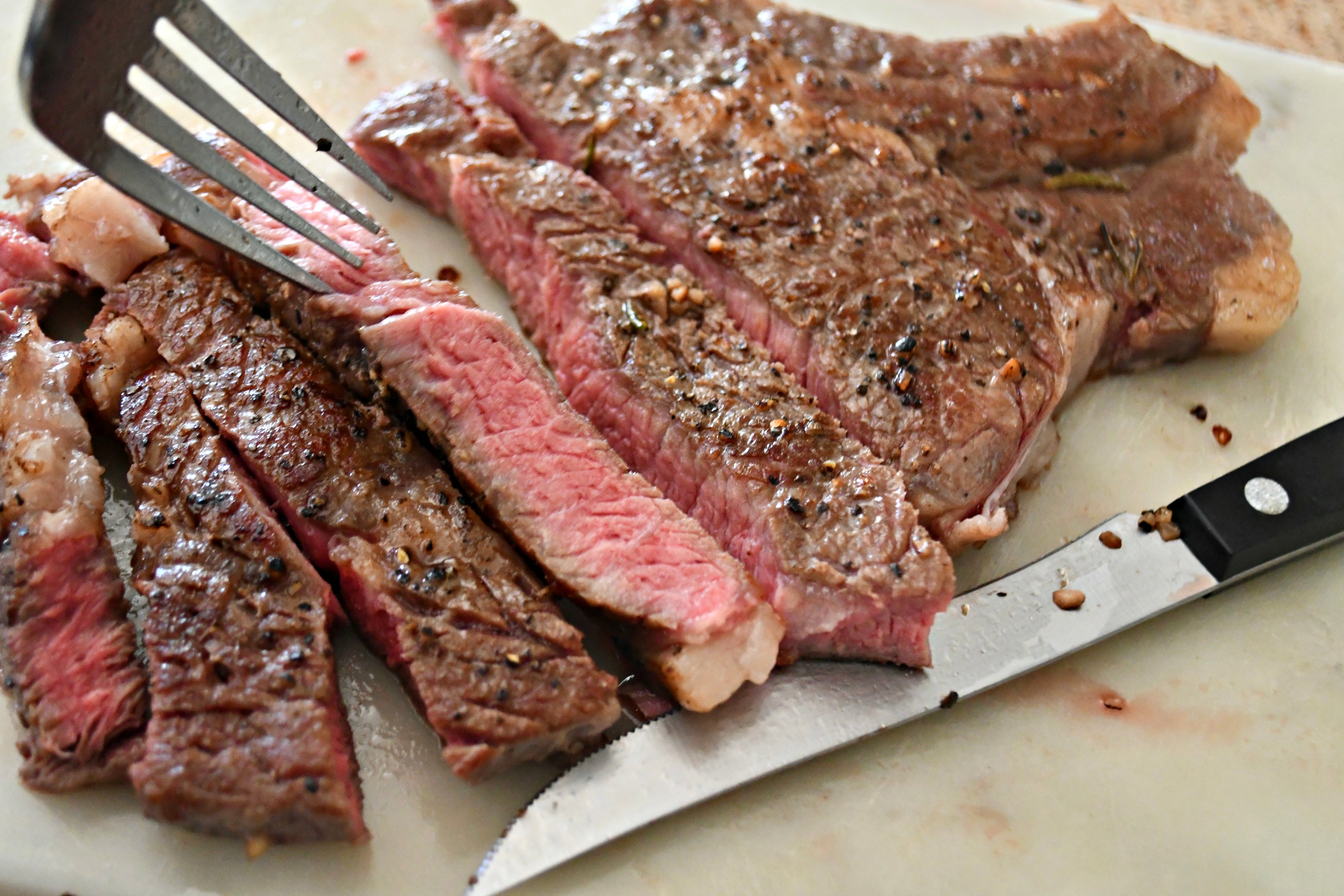 Make the Best Steak Using a Sous Vide! Sliced and served on a cutting board