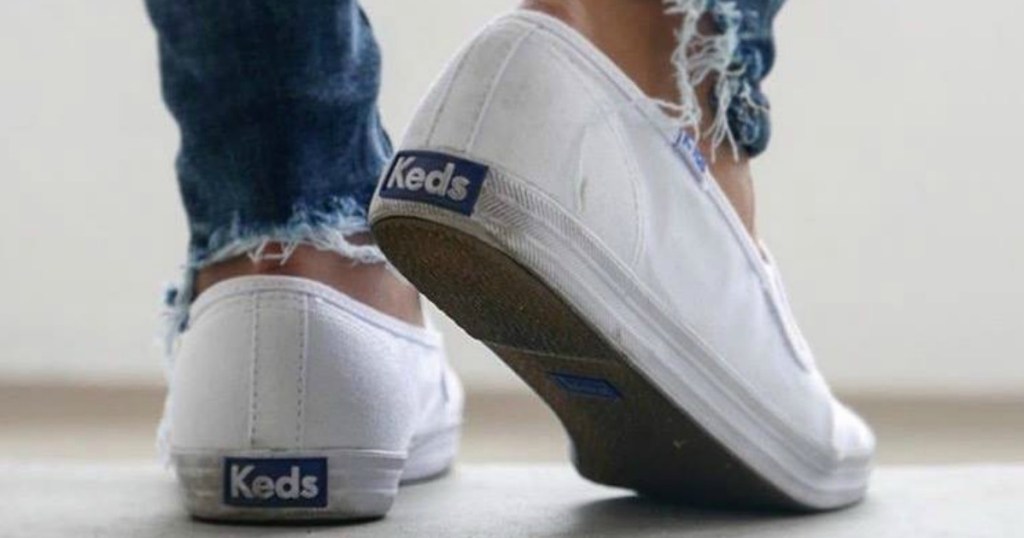 person wearing Keds sneakers