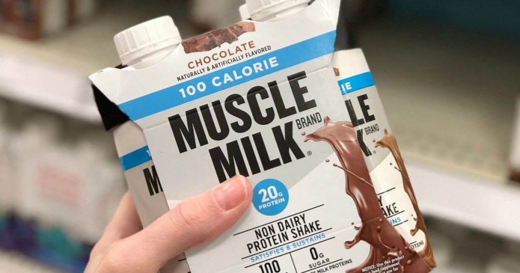 hand holding pack of Muscle Milk 100 calorie